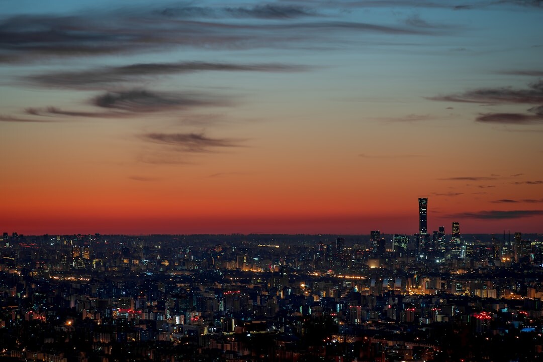 City skyline at dusk with warm lights