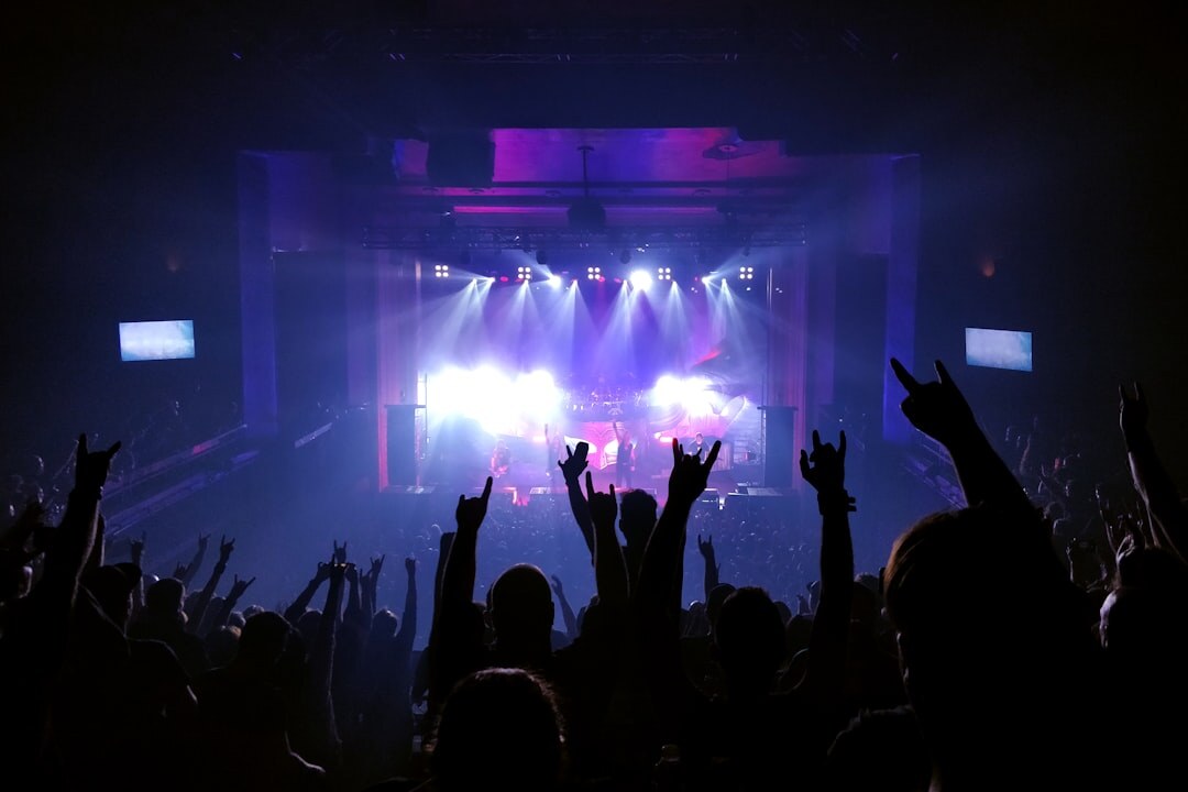 Concert crowd with colorful stage lights