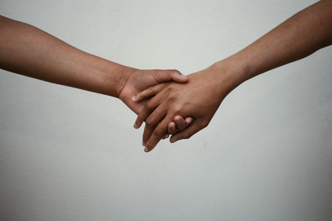 couple holding hands secretly