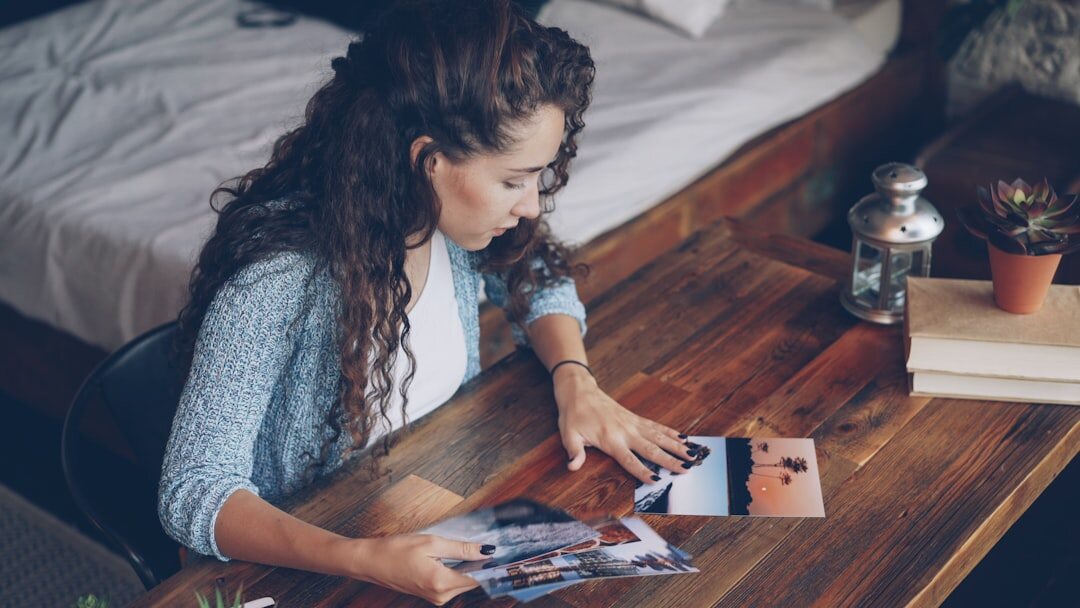 Editor reviewing photos and layouts on a desk
